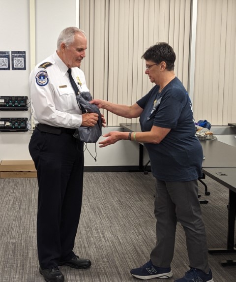 Vivian Wolpers, Program Officer, presents a gift of appreciation to Chief Manger